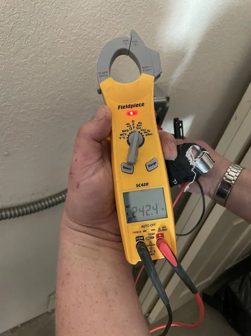 Voltage testing with clamp meter during Hot Tub / Pool Electrical Wiring in Forest Lake